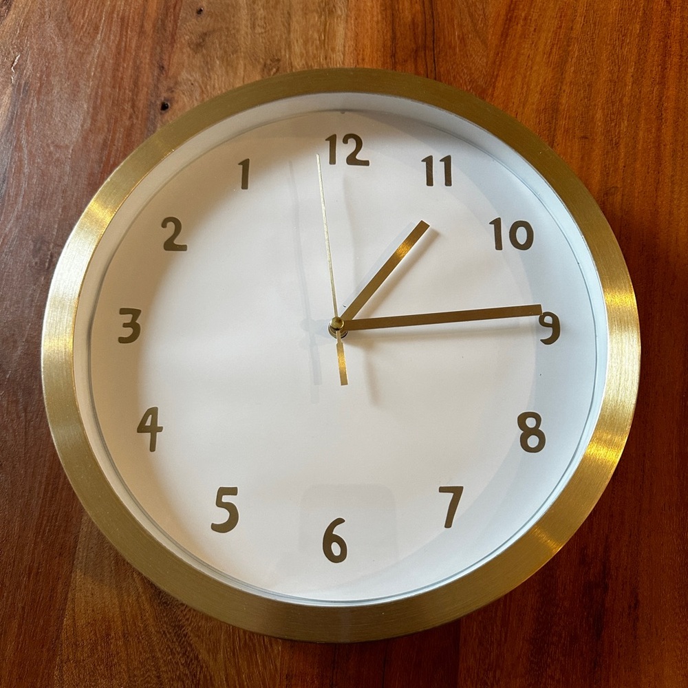 Backwards Novelty Gold and White Wall Clock